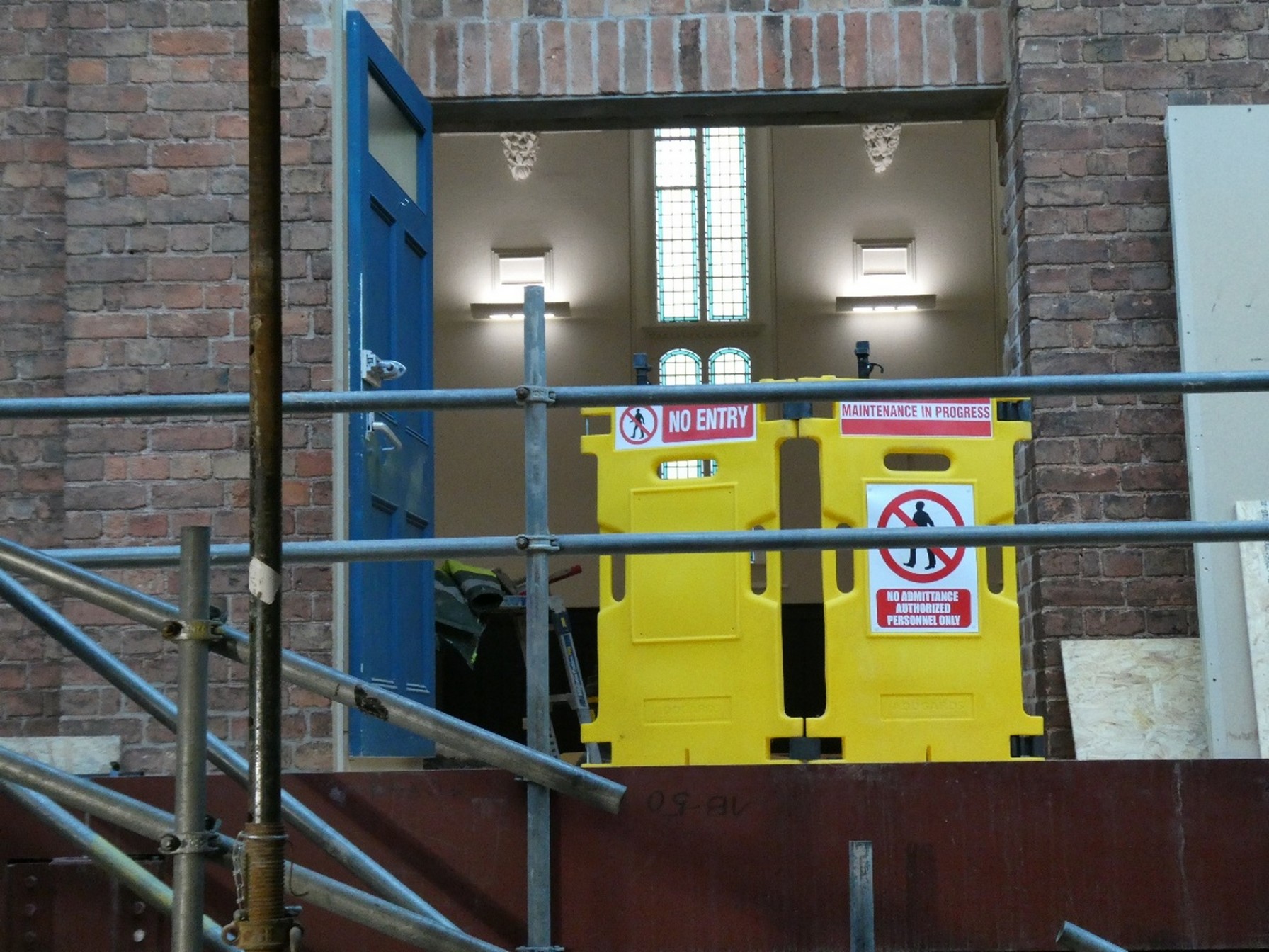 The view from the Foyer floor into Trinity Hall through the new entrance; the doors and balustrade will be mostly glass (ignore the yellow barriers!)