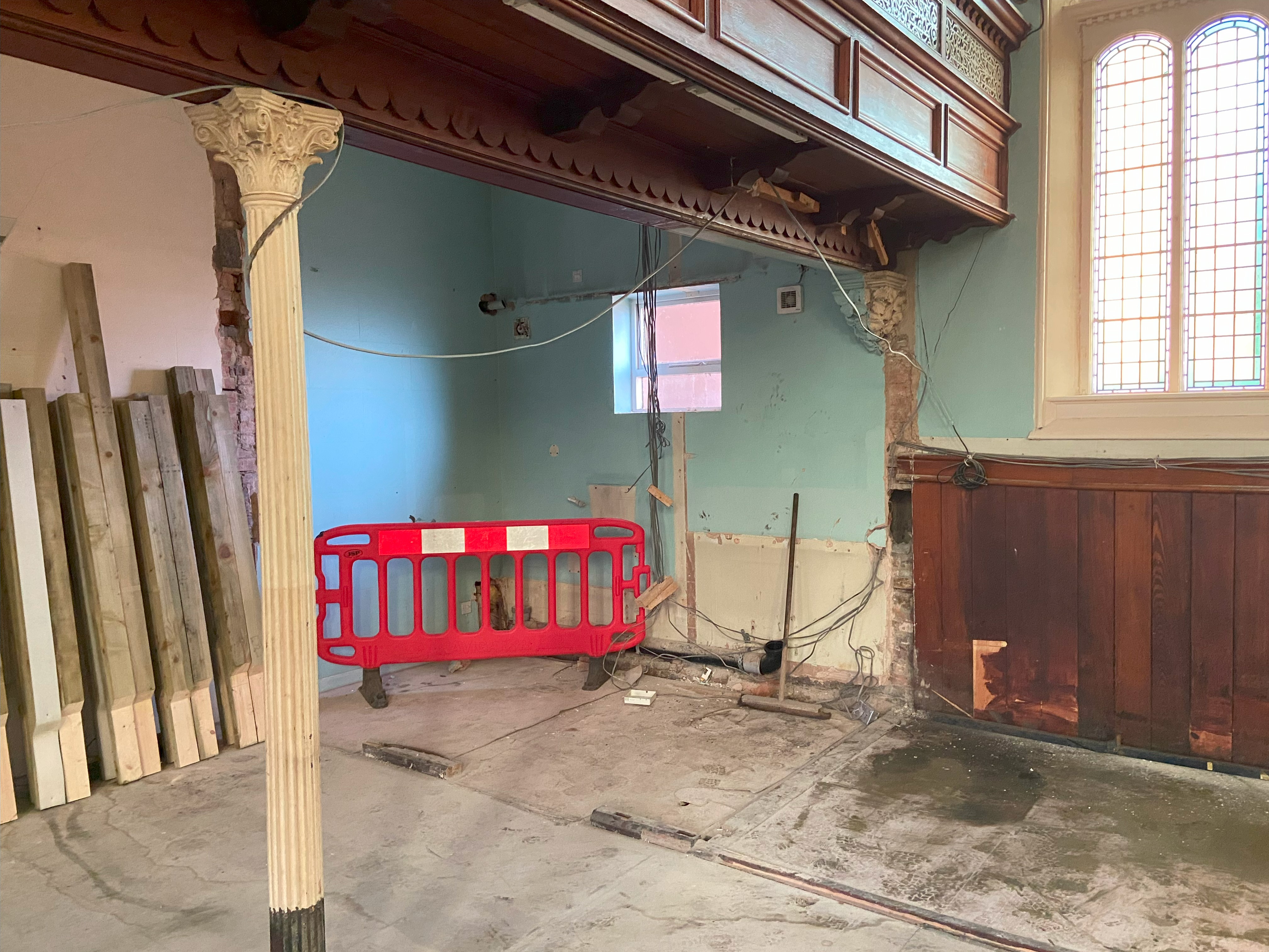 Photo of the inside of Ashbourne Methodist Church showing decorative columns and ornamentation which has been revealed by the removal of walls