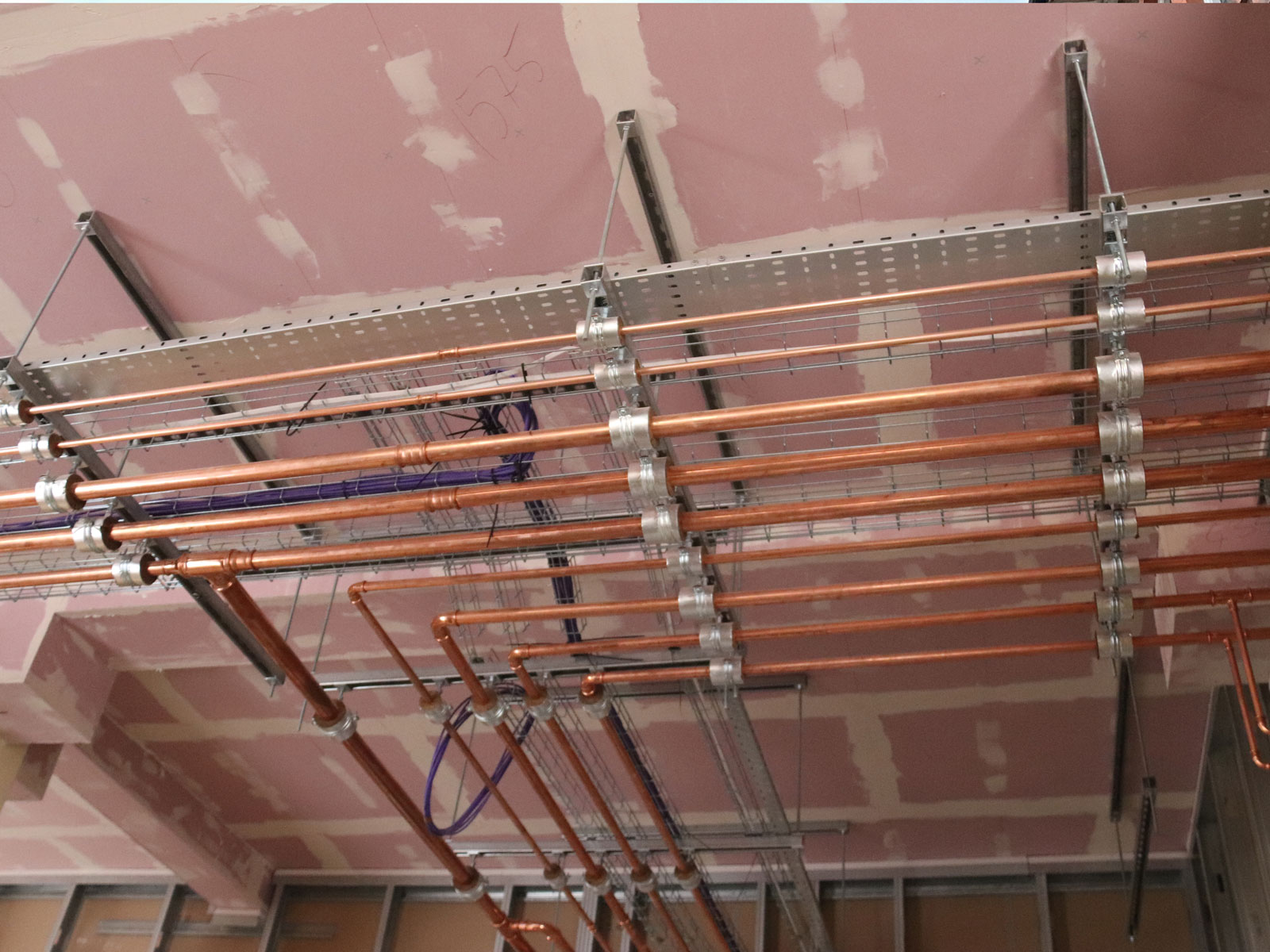 In Gateway Lodge water pipes for heating, hot and cold water (for the en-suites etc) are installed. There will be a new ceiling below them.