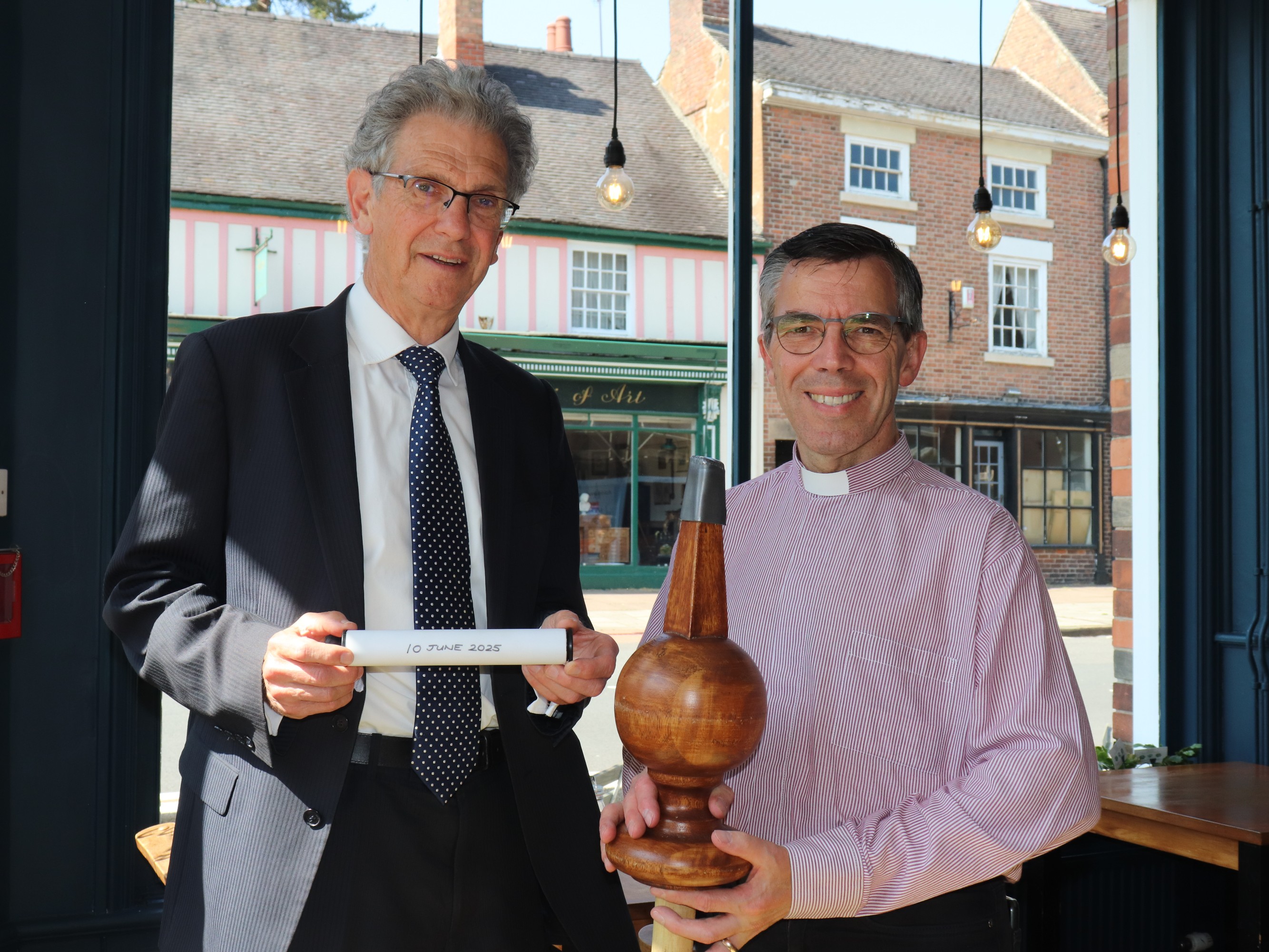 Councillor David Hughes of the Ashbourne Reborn Programme Board, and Revd Andy Fyall, Chair of the Nottingham & Derby District of the Methodist Church, with the time capsule and decorative finial